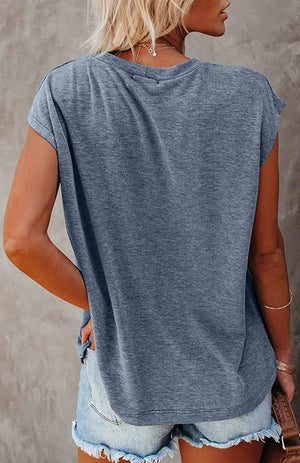 Back view of a woman wearing a lightweight, breathable Easy Breezy Tunic Shirt in heather gray with cap sleeves, paired with denim shorts.