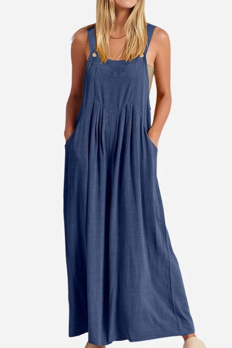 Woman wearing blue Free-Flow Wide Leg Overalls with adjustable straps and pockets