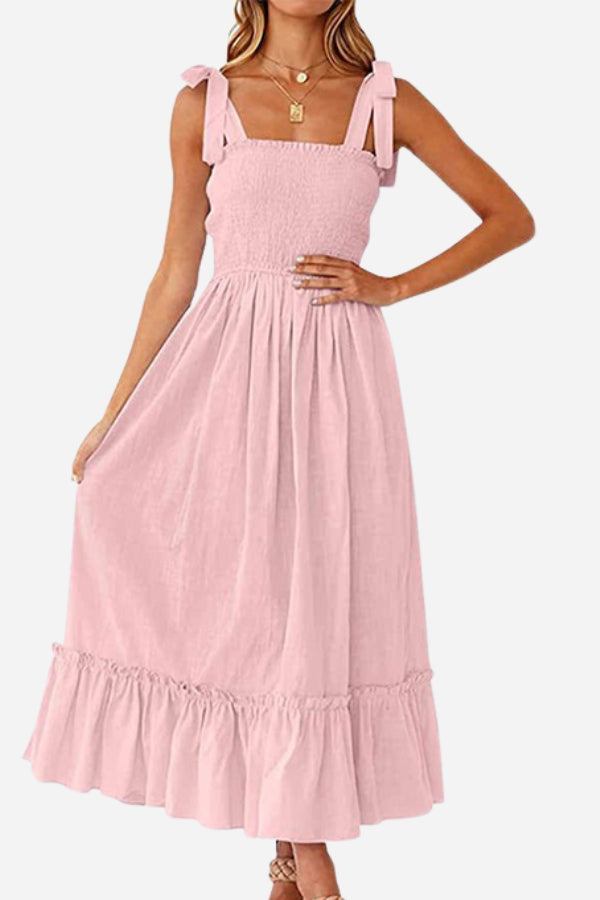 Pink Sunkissed Spaghetti Boho Dress with adjustable tie-up straps and flowy high-waist silhouette