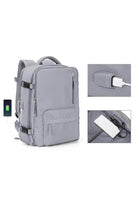 Chic Wanderlust Waterproof Backpack in grey with USB charging port and multiple compartments, durable and ergonomic design for travel and urban use.