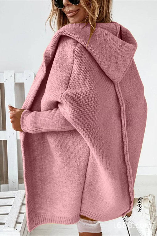 Pink warm oversized hooded cardigan with relaxed fit and soft knit fabric worn by woman
