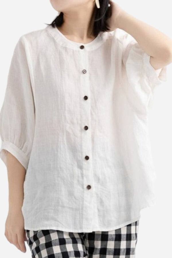 Relaxed loose breathable white linen blouse with button front and three-quarter sleeves