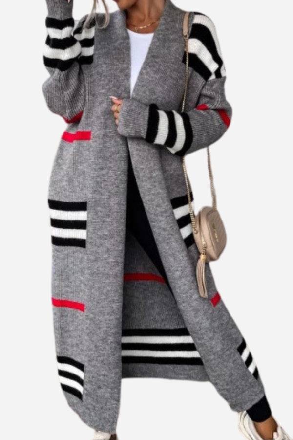 Cozy striped long knitted cardigan with oversized fit and red, black, white stripes on grey fabric
