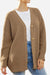 Relaxed fit oversized brown knitwear cardigan with button-down front worn over white t-shirt and blue jeans