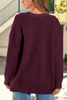 Relaxed fit oversized knitwear cardigan in deep burgundy with long sleeves and button-down front.