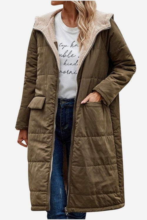 Long olive green sherpa-lined hooded teddy coat with large pockets and quilted puffer design for warmth and style.