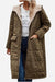 Long olive green sherpa-lined hooded teddy coat with large pockets and quilted puffer design for warmth and style.