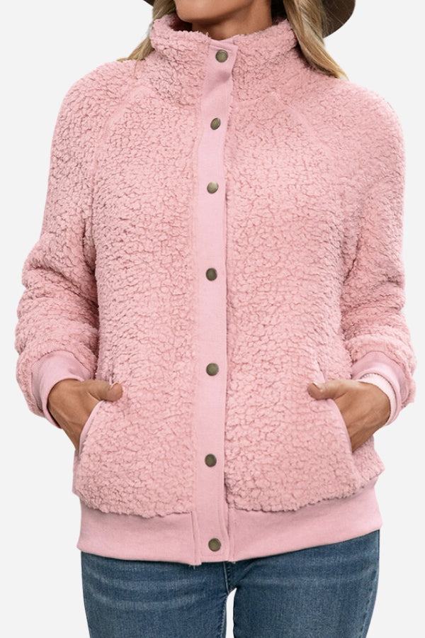 Cozy long sleeve pink sherpa jacket with button front and fleece interior for warmth and comfort