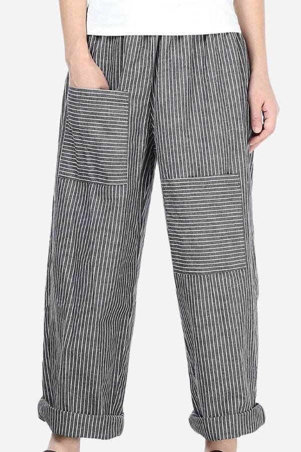 High waist striped comfort pants with large patch pockets and rolled cuffs on model