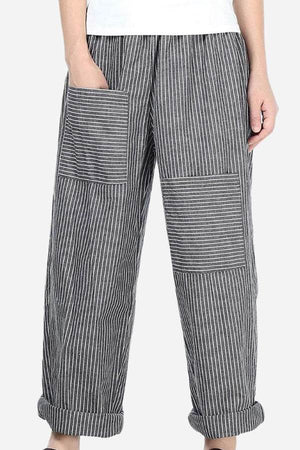 High waist striped comfort pants with large patch pockets and rolled cuffs on a female model