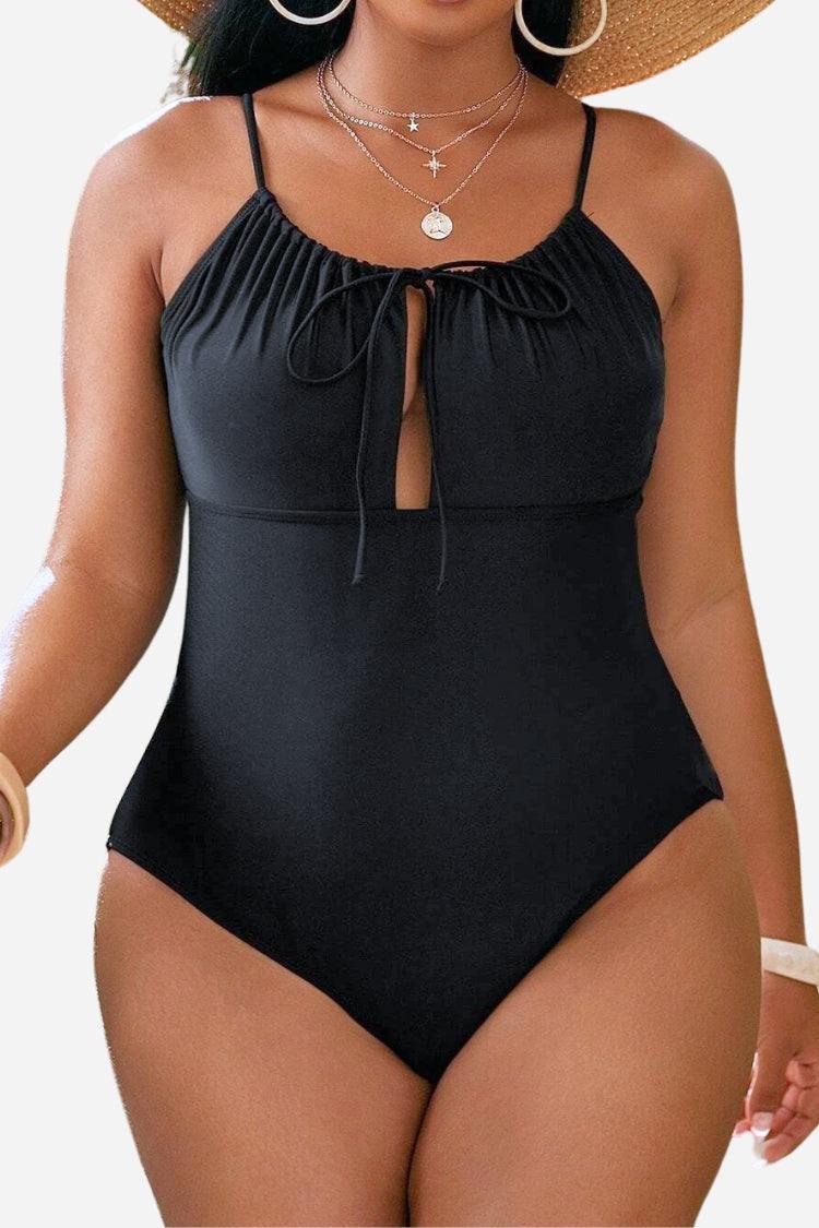 Curvy Comfort Plus Size black one-piece swimsuit with ruched bust and adjustable straps for supportive, flattering fit.