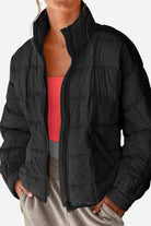 Lightweight puffer travel jacket packed compactly for travel convenience