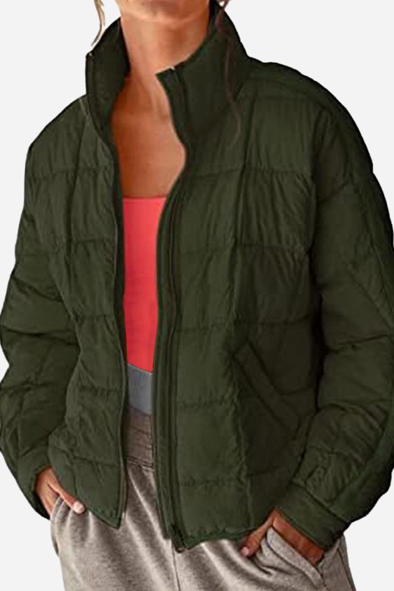 Lightweight puffer travel jacket folded compactly for easy packing and versatile outdoor wear