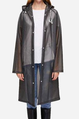 Chic Drizzle Defender lightweight black raincoat with hood, worn over casual outfit