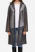 Chic Drizzle Defender lightweight black raincoat with hood, worn over casual outfit