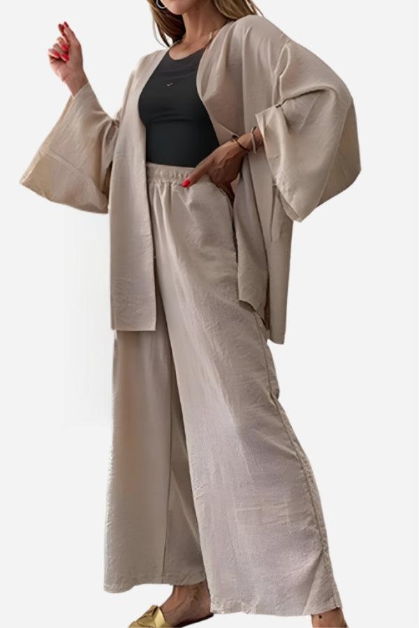 Beige chic comfort kimono two-piece set with wide sleeves and matching loose pants worn over a black top