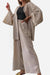 Beige chic comfort kimono two-piece set with wide sleeves and matching loose pants worn over a black top