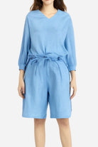 Blue two-piece set with loose V-neck shirt and high-waisted knee-length shorts made of breathable cotton