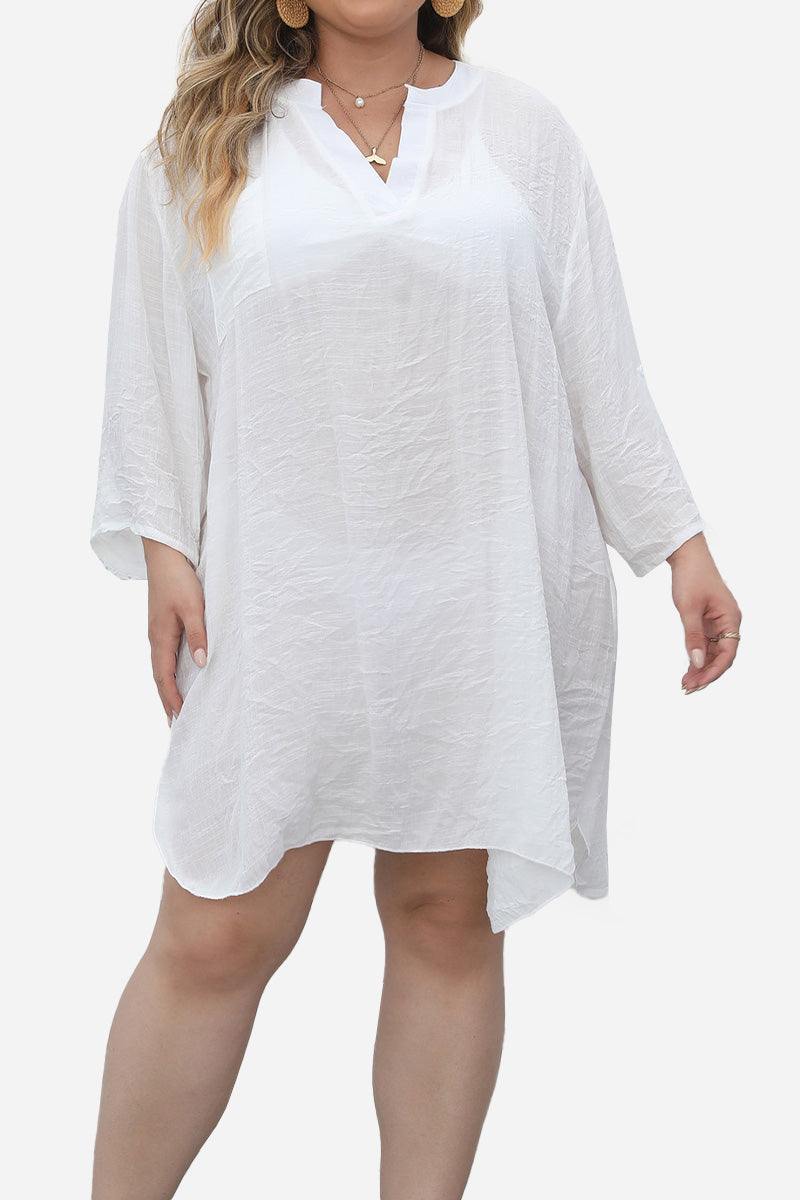 White airy V-neck tunic with 3/4 sleeves and asymmetrical hem on plus-size model