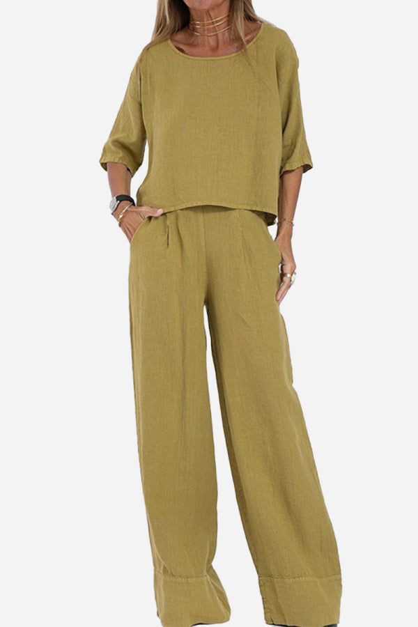 Olive green short-sleeved pullover and wide trouser matching set made of lightweight breathable cotton with deep pockets and relaxed fit.