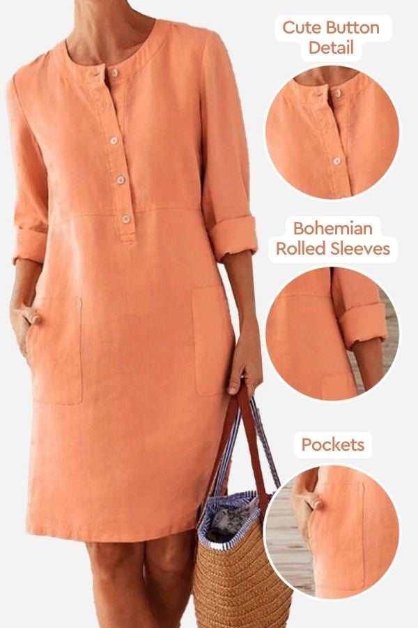 Orange cotton dress with button detail, rolled ¾ sleeves, and pockets, perfect for casual summer wear.