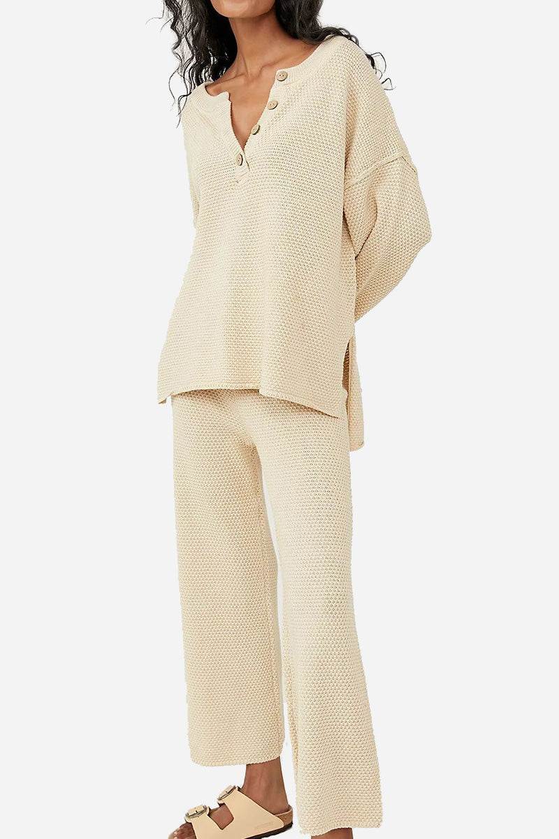 Multi-weather comfort two-piece oversized beige knit set with relaxed fit top and wide-leg pants.