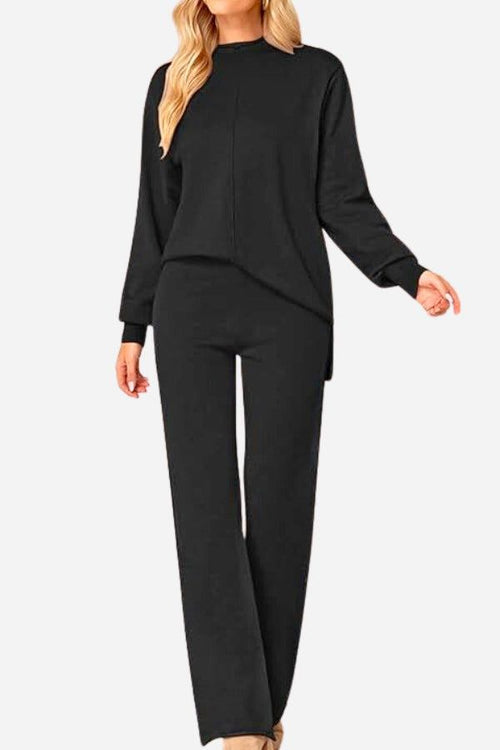 Black high neck sweater and wide leg pants set with center seam and relaxed fit for stylish comfort