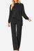 Black high neck sweater and wide leg pants set with center seam and relaxed fit for stylish comfort
