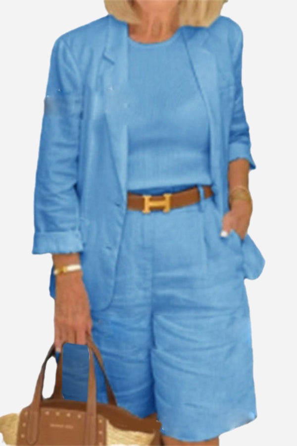 Blue blazer and high-waisted shorts two-piece set with rolled-up sleeves and matching top.