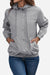 Women's light grey outdoor hooded raincoat and windbreaker jacket with button closure and elastic cuffs