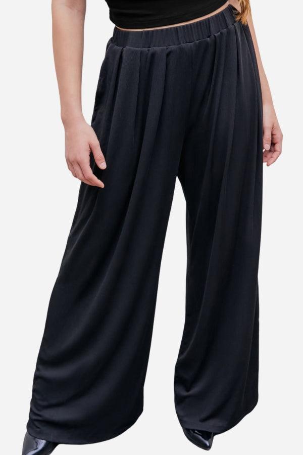 Black stretchy wide-leg pants with elastic waistband for all-day comfort and flattering silhouette