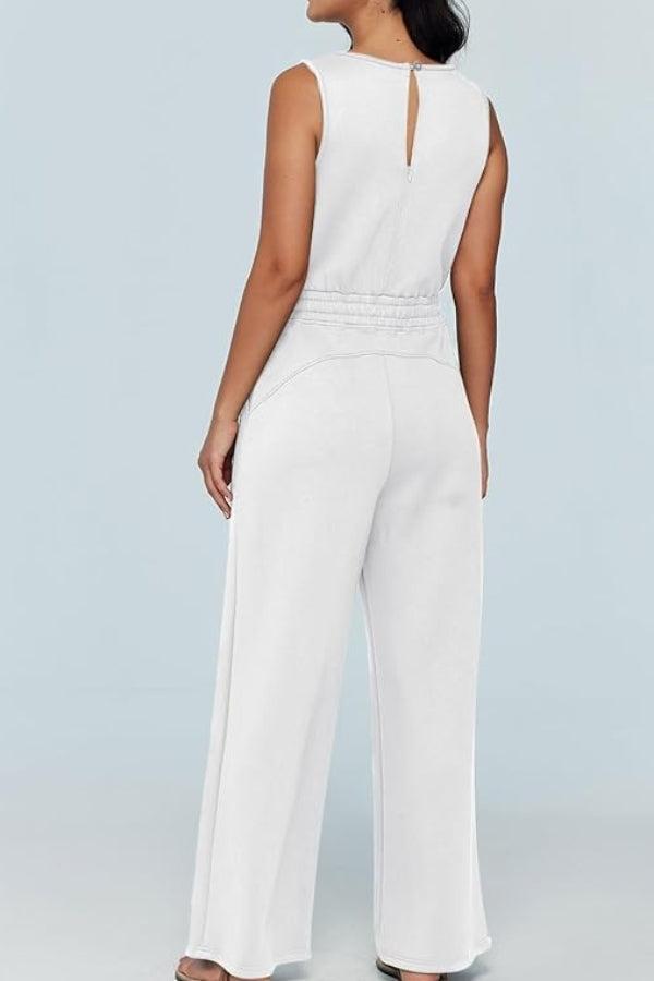woman wearing white sleeveless wide leg pants jumpsuit back view