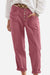 Women's casual button-down utility-chic trousers in pink with deep pockets and rolled cuffs.