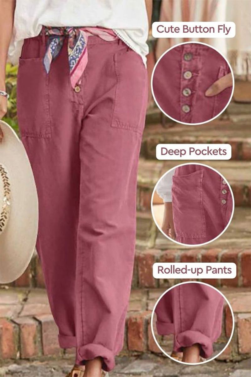 Casual button-down utility-chic trousers in pink with deep pockets, cute button fly, and rolled-up cuffs.