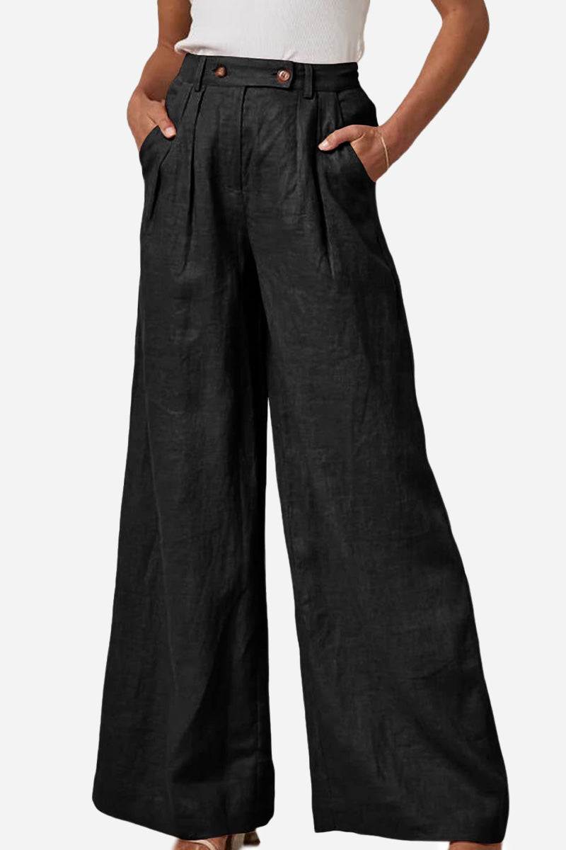 Black wide leg high waist trousers with elastic waistband and pockets.