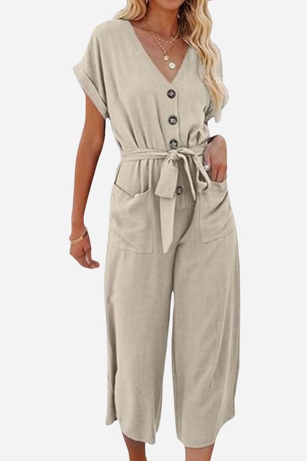 Beige V-neck lace-up pocket jumpsuit with tie waist and wide legs for a feminine and comfortable look