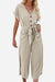 Beige V-neck lace-up pocket jumpsuit with tie waist and wide legs for a feminine and comfortable look