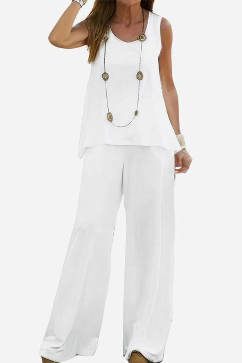 White two-piece co-ord outfit designed to balance apple-shaped body with sleeveless top and wide-leg pants.