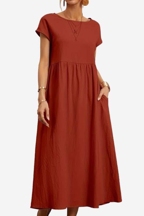 Rust red capped-sleeve voluminous pleated midi dress with pockets and relaxed fit