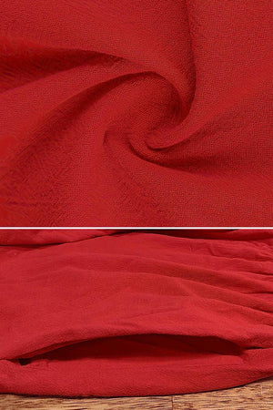 Red textured fabric close-up and pocket detail of capped-sleeve voluminous pleated midi dress