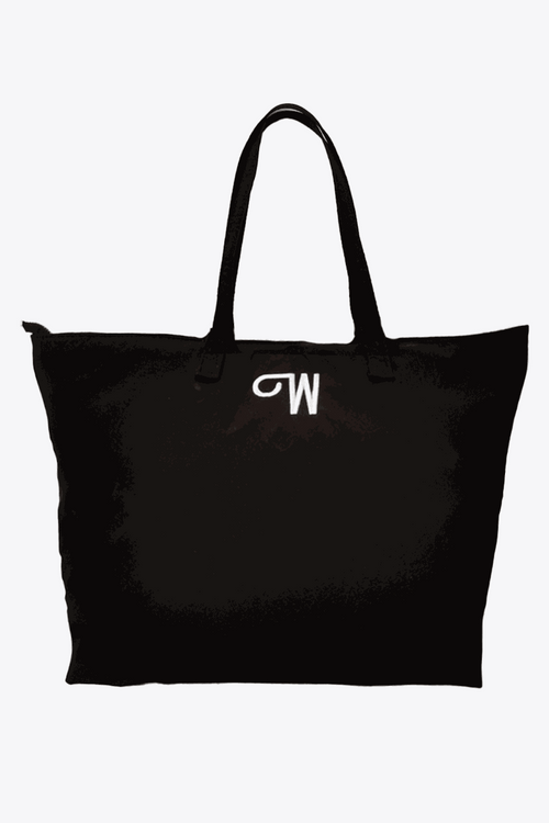 Black waterproof travel bag with sturdy handles and minimal design, spacious for everyday and travel use.