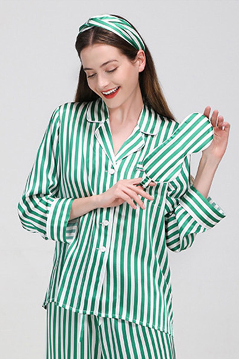 Woman wearing green and white striped mulberry silk long sleeve pajama set with matching headband and eye mask