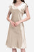 Woman wearing a beige Mulberry Silk V-Neck Nightgown with short sleeves and a flowing silhouette