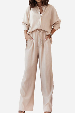 Woman wearing beige professional and smart two-piece set with button-up shirt and wide-leg pants