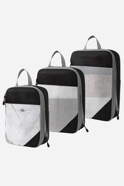 Set of three space-saving compression packing organizers with black and white design, mesh front panels, and zipper closures for efficient travel packing.