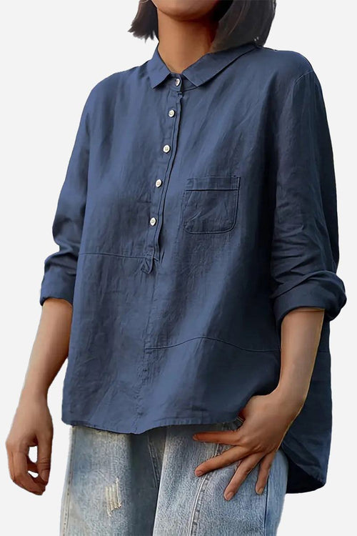 Women’s vintage linen shirt in navy blue with button-down front and single chest pocket, paired with casual jeans.