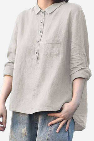 Vintage linen shirt in breathable cotton-linen blend with rolled sleeves and front pocket, styled casually with jeans.