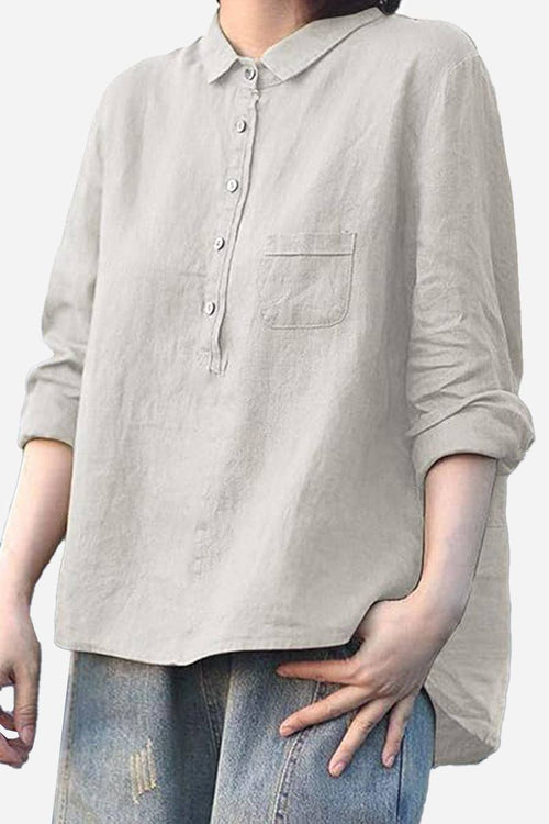 Vintage linen shirt in breathable cotton-linen blend with rolled sleeves and front pocket, styled casually with jeans.