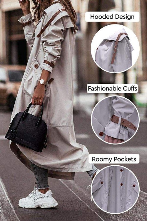 Woman wearing beige minimalist hooded coat with fashionable cuffs and roomy pockets, styled for urban travel.