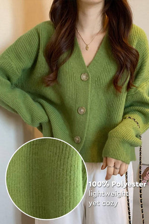 Green casual loose boxy cardigan made of 100% polyester with ribbed texture and oversized fit